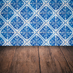 Image showing Wood table top and blur vintage ceramic tile pattern wall