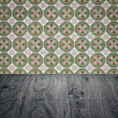 Image showing Wood table top and blur vintage ceramic tile pattern wall