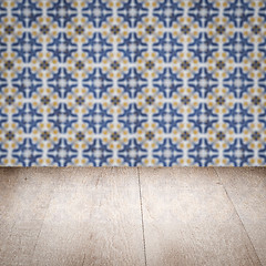 Image showing Wood table top and blur vintage ceramic tile pattern wall