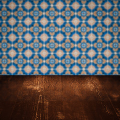 Image showing Wood table top and blur vintage ceramic tile pattern wall