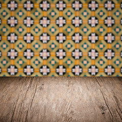 Image showing Wood table top and blur vintage ceramic tile pattern wall