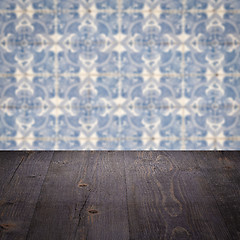 Image showing Wood table top and blur vintage ceramic tile pattern wall