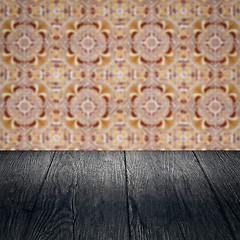 Image showing Wood table top and blur vintage ceramic tile pattern wall