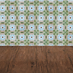 Image showing Wood table top and blur vintage ceramic tile pattern wall