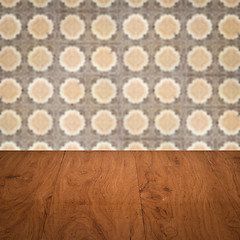 Image showing Wood table top and blur vintage ceramic tile pattern wall