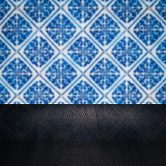 Image showing Wood table top and blur vintage ceramic tile pattern wall