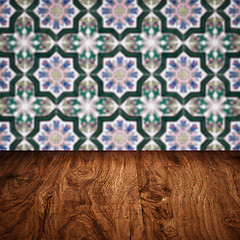 Image showing Wood table top and blur vintage ceramic tile pattern wall