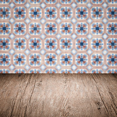 Image showing Wood table top and blur vintage ceramic tile pattern wall