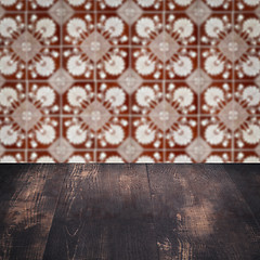 Image showing Wood table top and blur vintage ceramic tile pattern wall