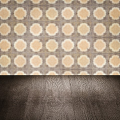 Image showing Wood table top and blur vintage ceramic tile pattern wall