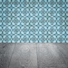 Image showing Wood table top and blur vintage ceramic tile pattern wall