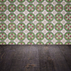 Image showing Wood table top and blur vintage ceramic tile pattern wall