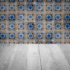 Image showing Wood table top and blur vintage ceramic tile pattern wall