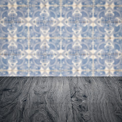 Image showing Wood table top and blur vintage ceramic tile pattern wall