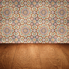 Image showing Wood table top and blur vintage ceramic tile pattern wall