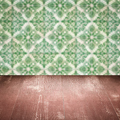 Image showing Wood table top and blur vintage ceramic tile pattern wall