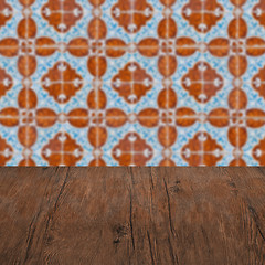 Image showing Wood table top and blur vintage ceramic tile pattern wall