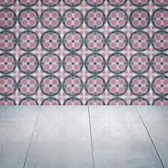 Image showing Wood table top and blur vintage ceramic tile pattern wall