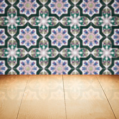 Image showing Wood table top and blur vintage ceramic tile pattern wall