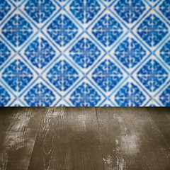 Image showing Wood table top and blur vintage ceramic tile pattern wall