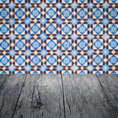 Image showing Wood table top and blur vintage ceramic tile pattern wall