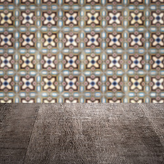 Image showing Wood table top and blur vintage ceramic tile pattern wall