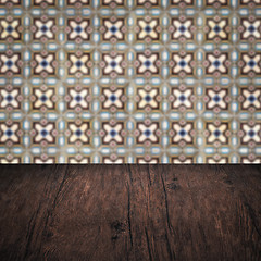 Image showing Wood table top and blur vintage ceramic tile pattern wall