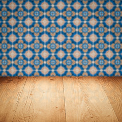 Image showing Wood table top and blur vintage ceramic tile pattern wall