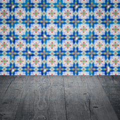 Image showing Wood table top and blur vintage ceramic tile pattern wall