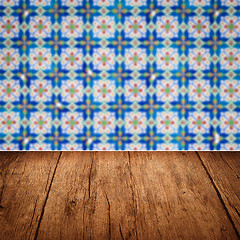 Image showing Wood table top and blur vintage ceramic tile pattern wall