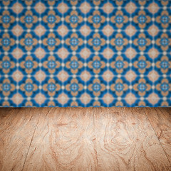 Image showing Wood table top and blur vintage ceramic tile pattern wall