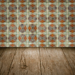 Image showing Wood table top and blur vintage ceramic tile pattern wall