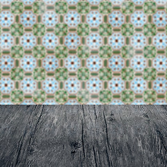 Image showing Wood table top and blur vintage ceramic tile pattern wall