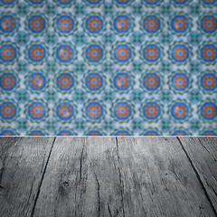 Image showing Wood table top and blur vintage ceramic tile pattern wall