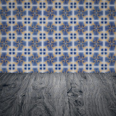 Image showing Wood table top and blur vintage ceramic tile pattern wall