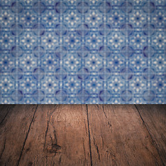 Image showing Wood table top and blur vintage ceramic tile pattern wall