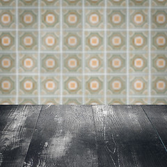 Image showing Wood table top and blur vintage ceramic tile pattern wall