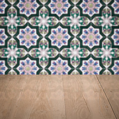 Image showing Wood table top and blur vintage ceramic tile pattern wall