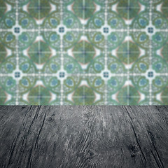 Image showing Wood table top and blur vintage ceramic tile pattern wall