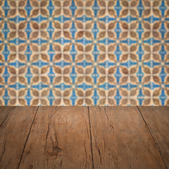 Image showing Wood table top and blur vintage ceramic tile pattern wall