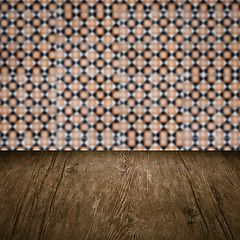 Image showing Wood table top and blur vintage ceramic tile pattern wall