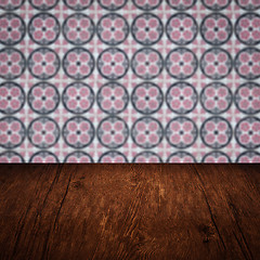 Image showing Wood table top and blur vintage ceramic tile pattern wall