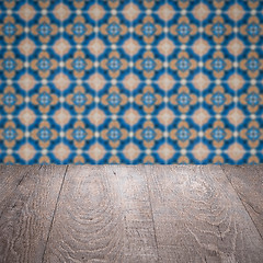 Image showing Wood table top and blur vintage ceramic tile pattern wall