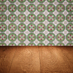 Image showing Wood table top and blur vintage ceramic tile pattern wall