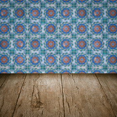 Image showing Wood table top and blur vintage ceramic tile pattern wall