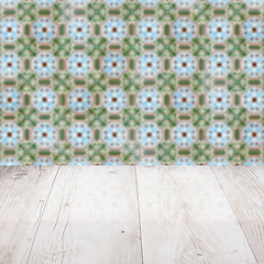 Image showing Wood table top and blur vintage ceramic tile pattern wall