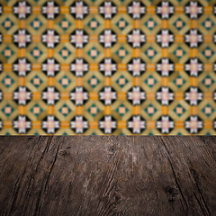 Image showing Wood table top and blur vintage ceramic tile pattern wall