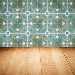 Image showing Wood table top and blur vintage ceramic tile pattern wall