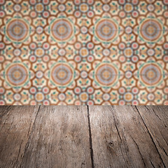 Image showing Wood table top and blur vintage ceramic tile pattern wall