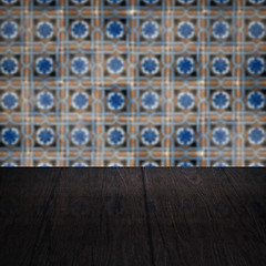 Image showing Wood table top and blur vintage ceramic tile pattern wall